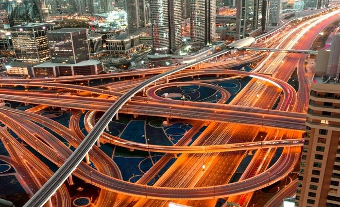 Transportation Problems in Dubai: Addressing Traffic Issues and Beyond high angle shot illuminated highway with multilevel intersections megapolis night 181624 27472